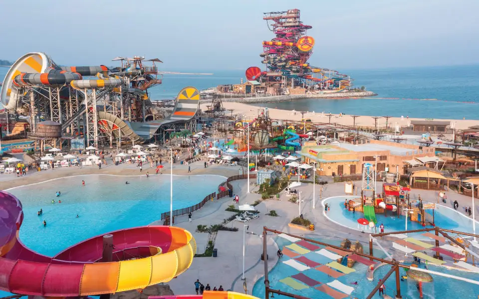 Aerial view of a colourful waterpark with slides and pools